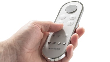 Hand with AquaClean Mera remote control